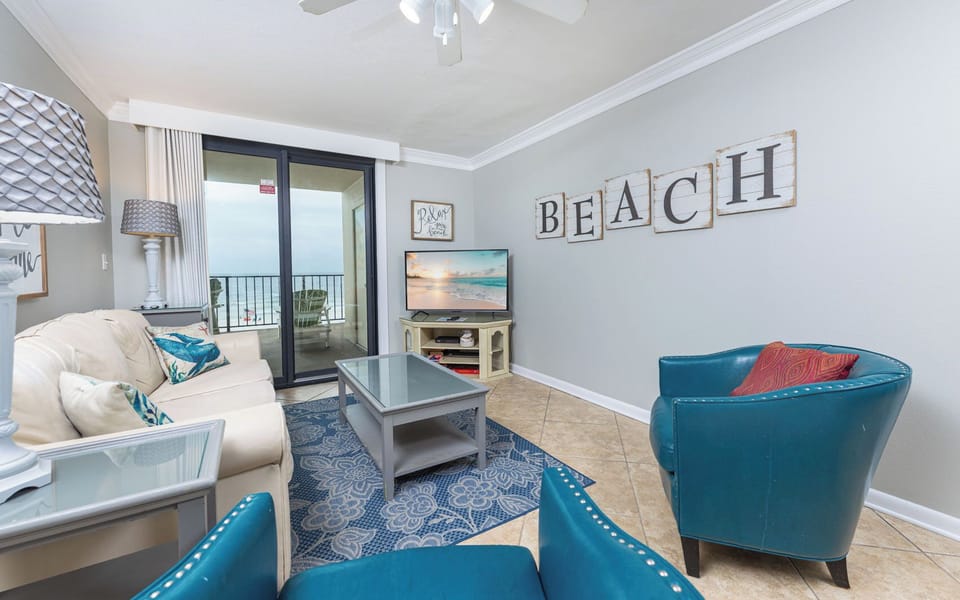 Unwind on the sofa with a queen sleeper while enjoying your favorite shows, with coastal views from the balcony