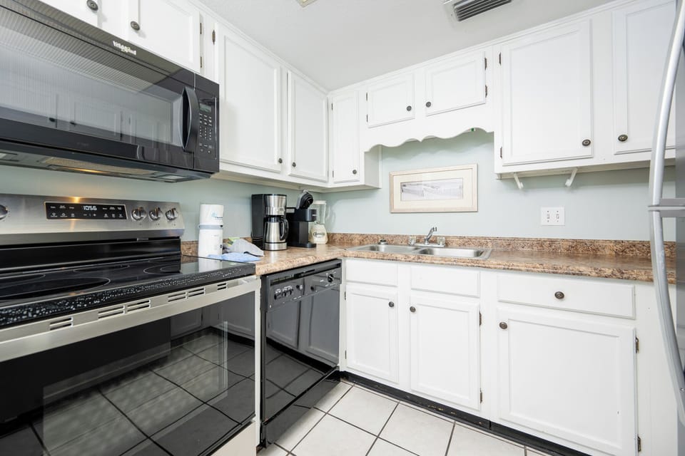 Embrace your culinary creativity in this inviting kitchen, equipped for effortless meal prep and family bonding