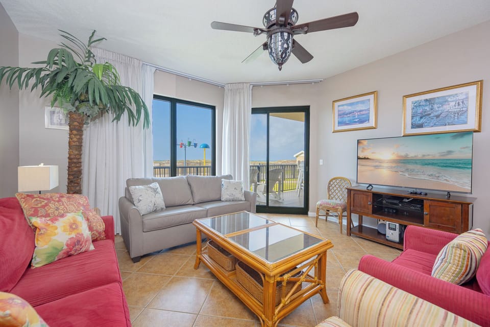 Inviting living area, featuring comfortable seating and a large TV for entertainment and leisure