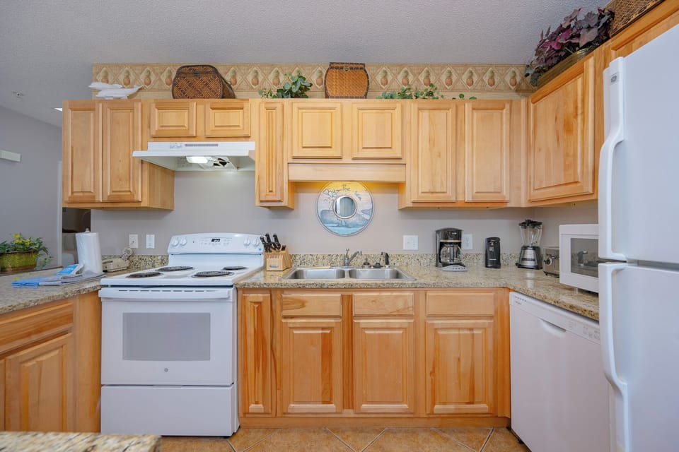 Prepare meals easily in the spacious kitchen with granite countertops and seating at the bar for casual dining
