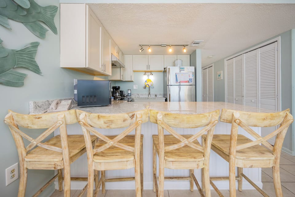 Gather with your family at the stylish bar stools, enjoying time together while sipping drinks and sharing stories
