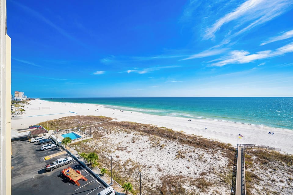 Savor the stunning beach views from your balcony, feeling the warmth of the sun as you relax and recharge