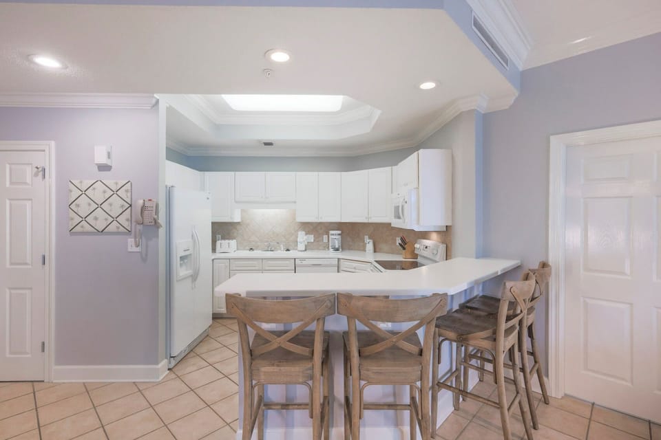 Sip your morning coffee at the breakfast bar and get ready for a day of adventure in this stylish space