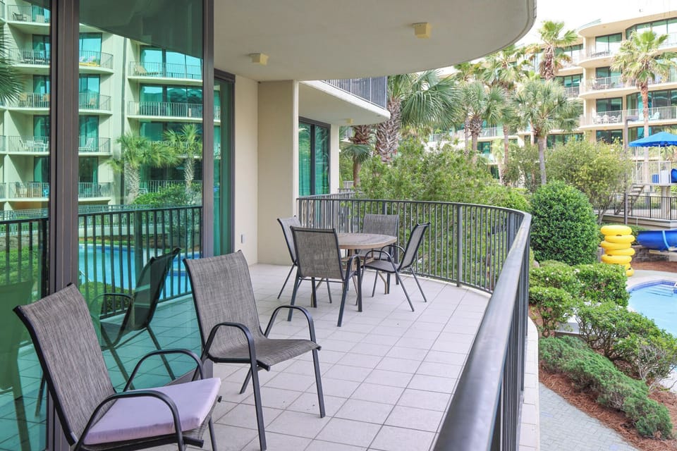 Sip your morning coffee on your spacious balcony, embracing the tranquil pool views below