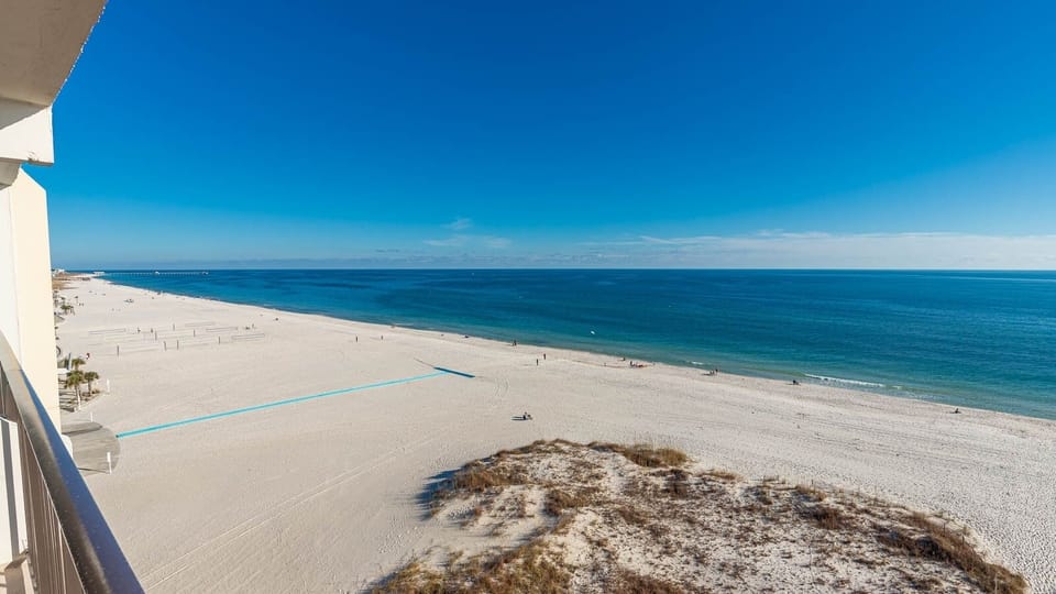 Enjoy breathtaking beachfront views from your private balcony, perfect for relaxation and soaking in the scenery