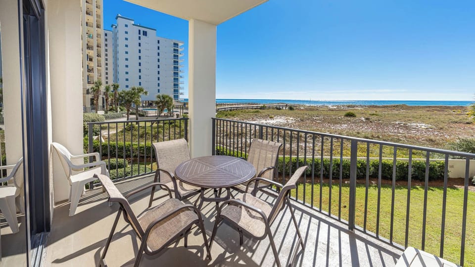 Relax on your balcony with a drink, soaking in the coastal views and gentle breeze from your beach retreat