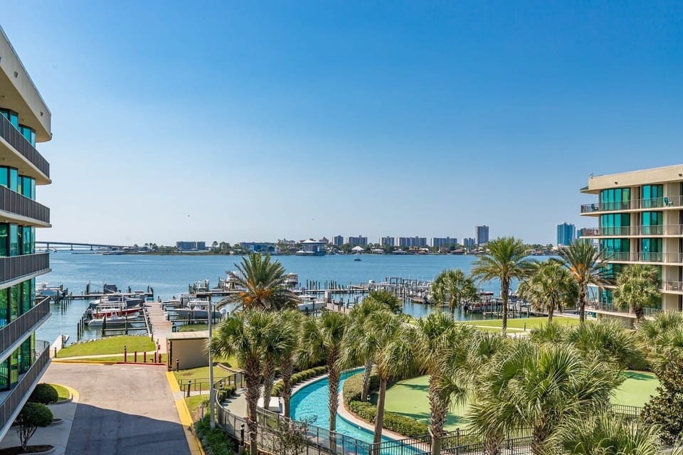 Breathe in the fresh coastal air from the spacious balcony while enjoying stunning views of the bay and lush greenery