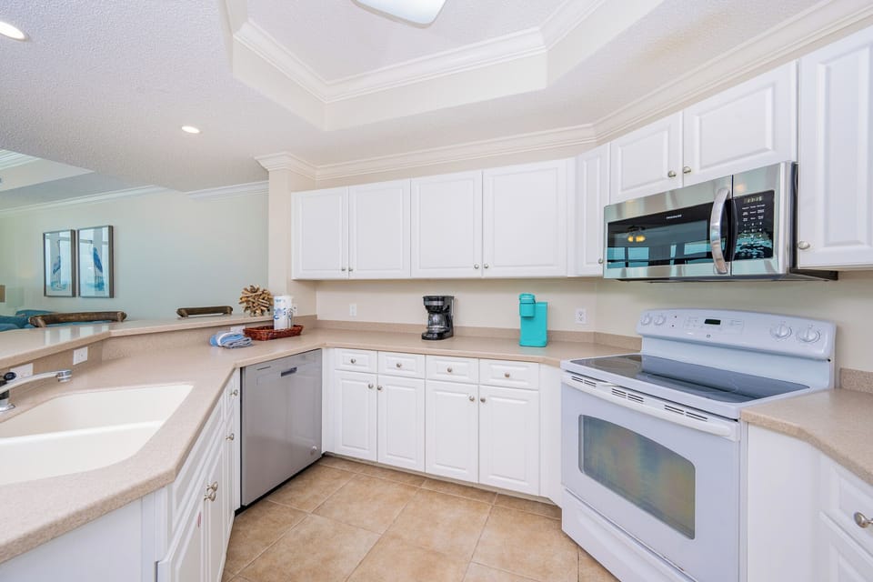 Create your favorite meals in this kitchen, enjoying quality time and the inviting coastal vibe with family