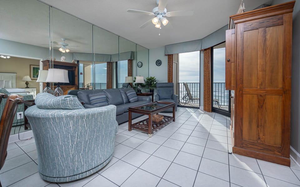 Relax in the inviting living area with comfortable sofa with queen sleeper and stunning beachfront views