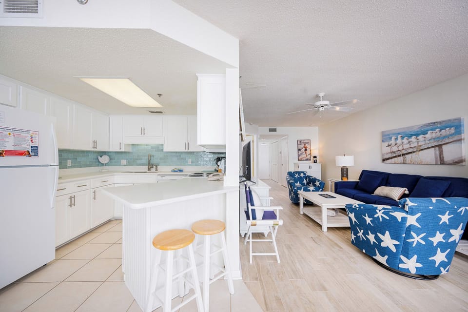 Soft coastal hues surround you in this living room where you relax with family and stream your favorite shows