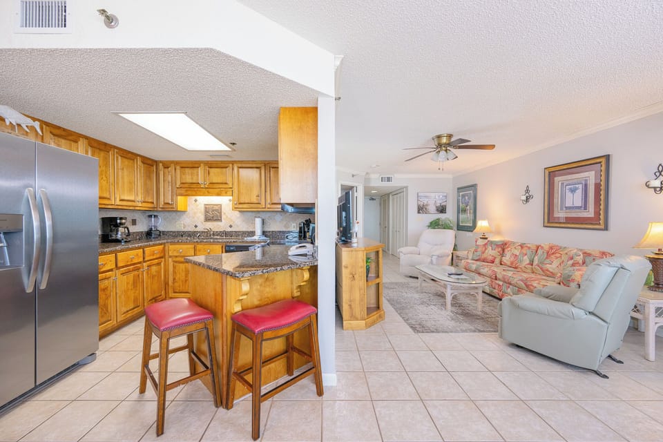 Create memorable family meals with ease in your inviting kitchen, featuring warm wood cabinetry