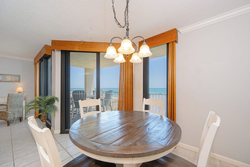 Savor fresh coffee at your round dining table while catching stunning beach views through expansive windows
