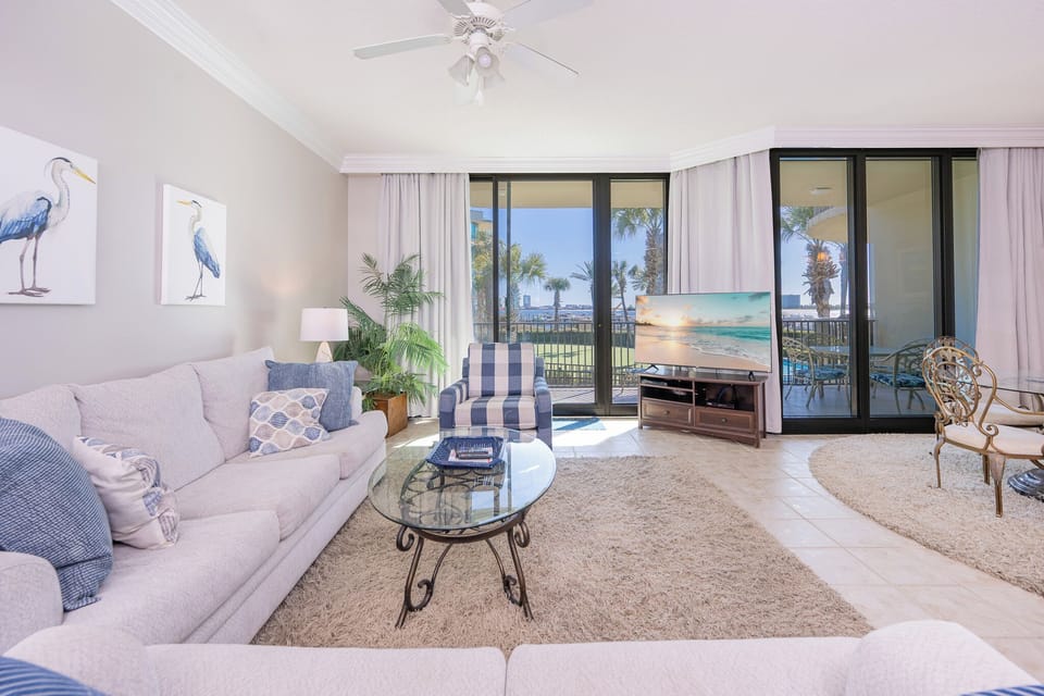Relax in the inviting living area on the sofa with queen sleeper enjoying a gentle breeze with your favorite shows
