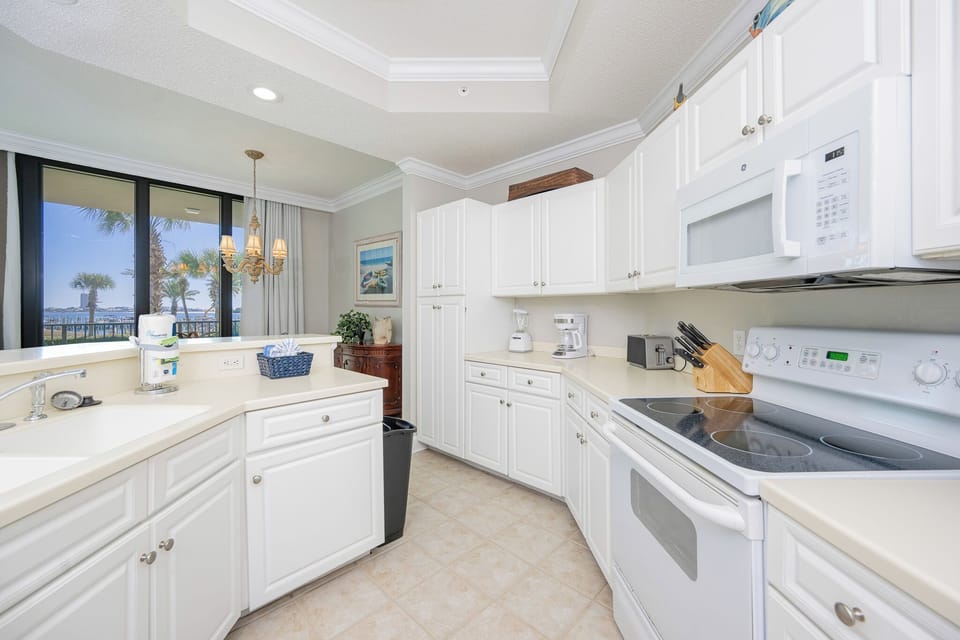 Experience delightful cooking moments in the bright kitchen while enjoying views of the beautiful bay