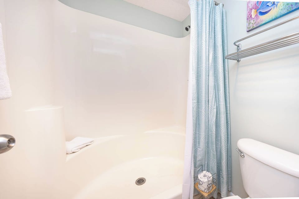 Refresh in the master bathroom featuring a walk-in shower and soft towels for your comfort during your stay