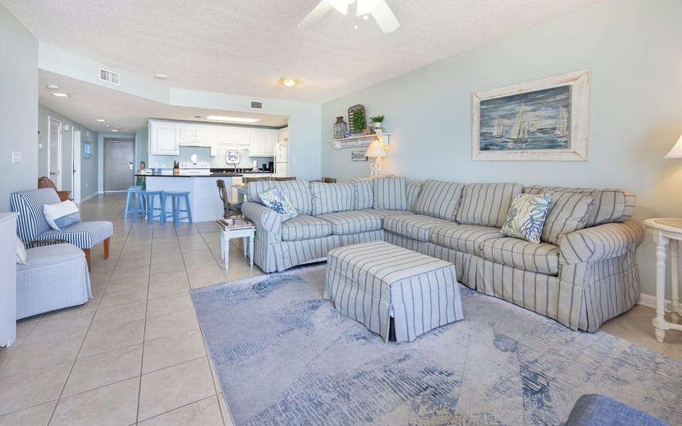 Relax in the spacious living area with a sofa with queen sleeper and easy access to the kitchen for delightful meals