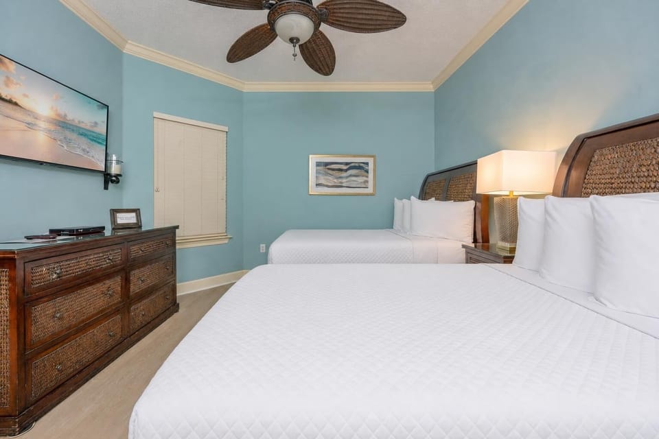 Tranquil guest room featuring two comfortable double beds, soft linens, and easy access to the adjoining bathroom