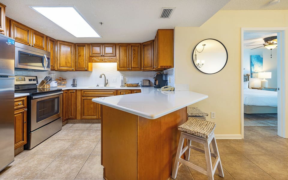 Warm wood cabinets surround the kitchen where you prepare fresh family meals
