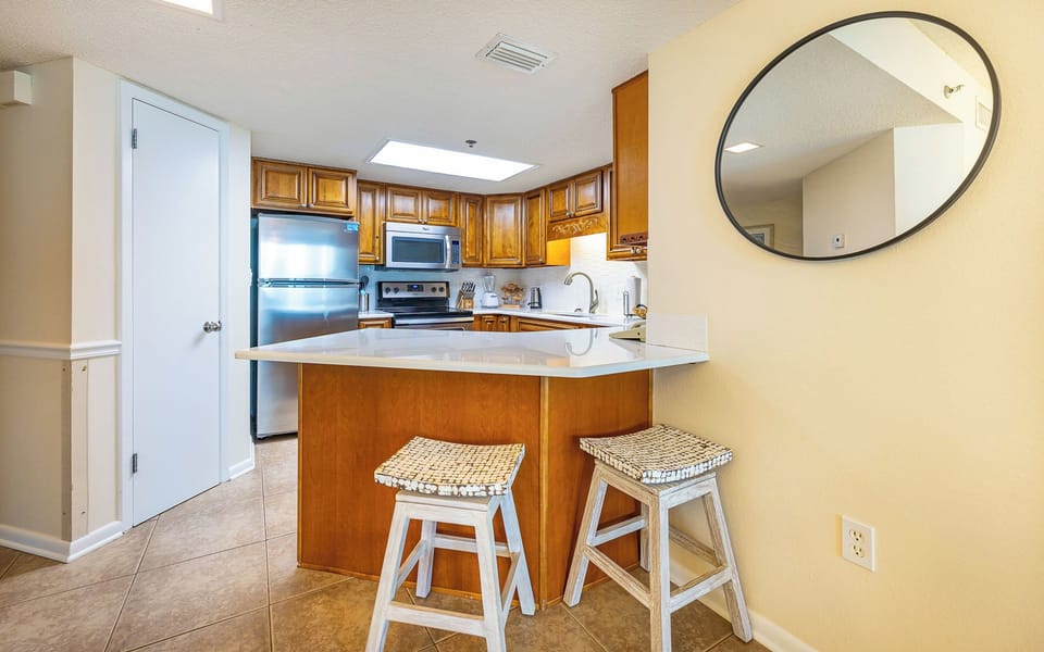 Morning light brightens the kitchen as you settle at the breakfast bar for a fresh coffee or quick bite