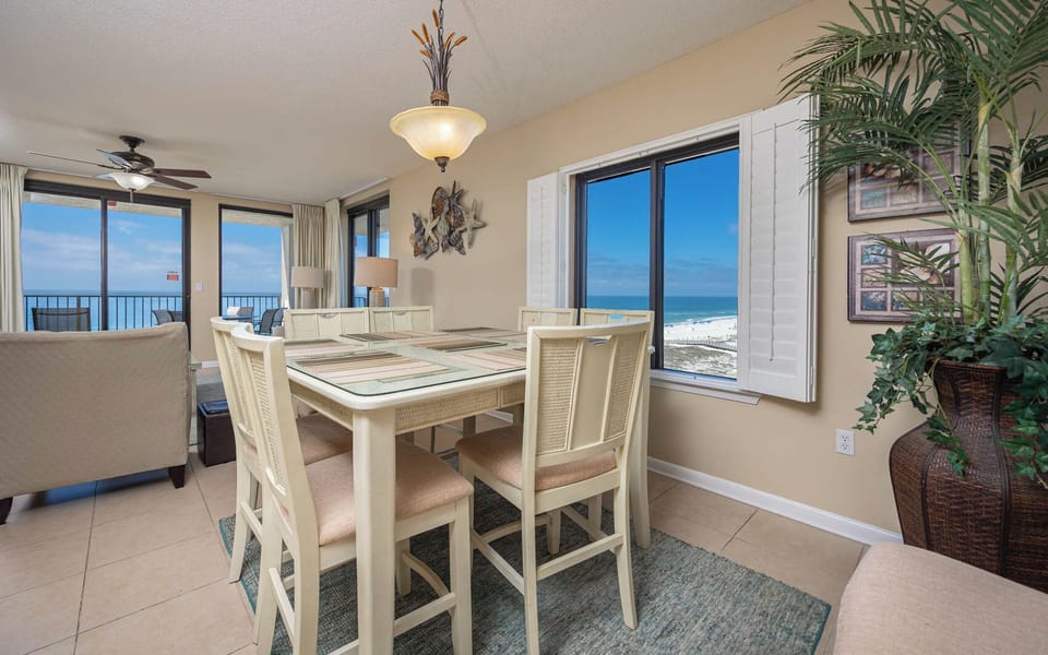 Dine at the table while enjoying panoramic views of the coast through large windows that invite natural light