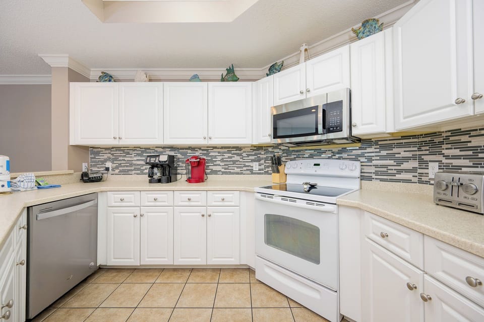 Whip up delicious meals at the inviting kitchen, surrounded by coastal decor and ample countertop space