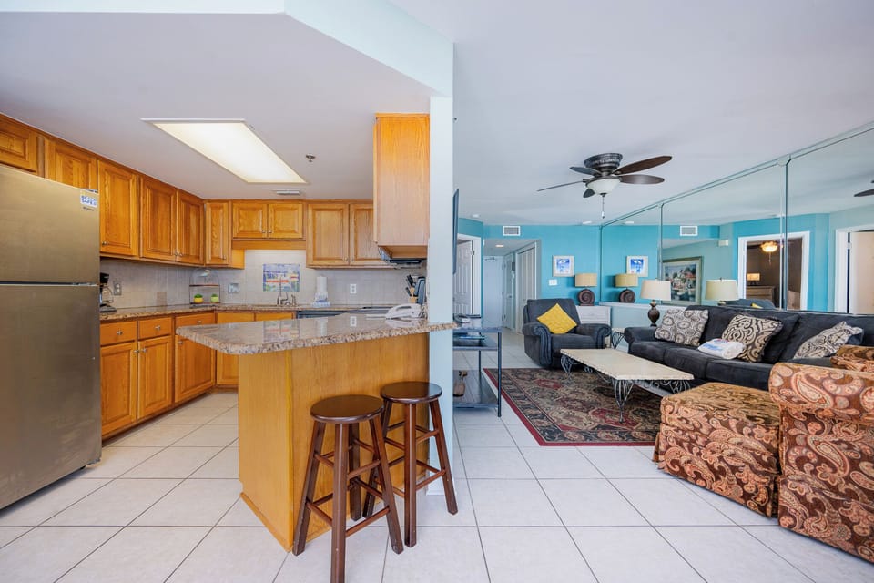Your living room invites cozy evenings with loved ones on plush seating while catching your favorite shows