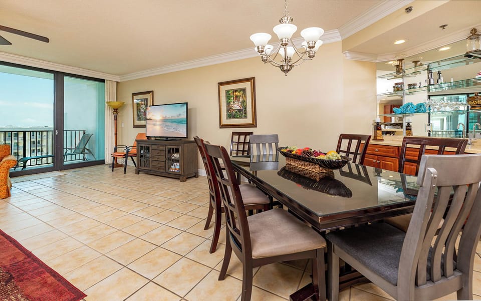 Gaze out at the bay from your inviting dining area, enjoying family game night or your favorite shows on the TV