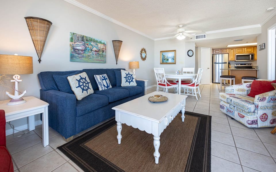 Unwind in the living area, featuring nautical decor and a sofa with queen sleeper