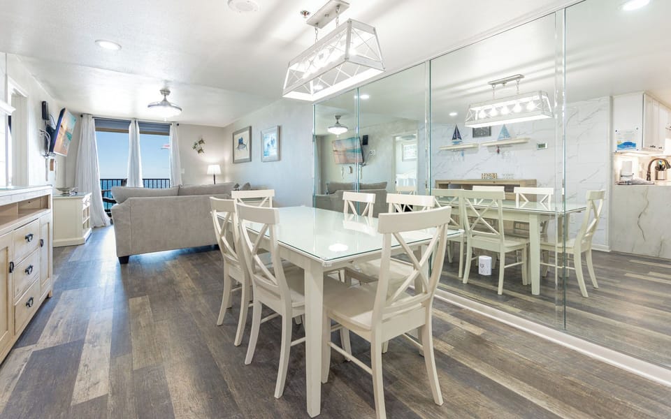 Gather around the sleek dining table and enjoy quality moments with loved ones