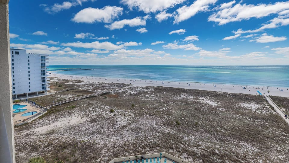 Gaze at the expansive coast from your balcony, absorbing the serene vibes and sounds of the shoreline