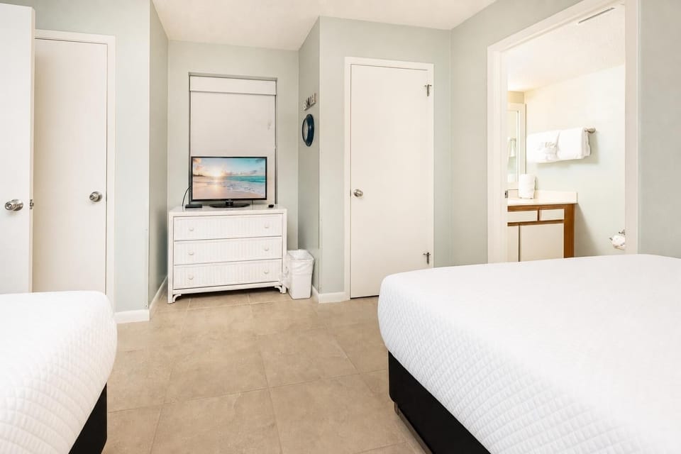 Cozy guest room with a TV for relaxing after a fun day at the beach