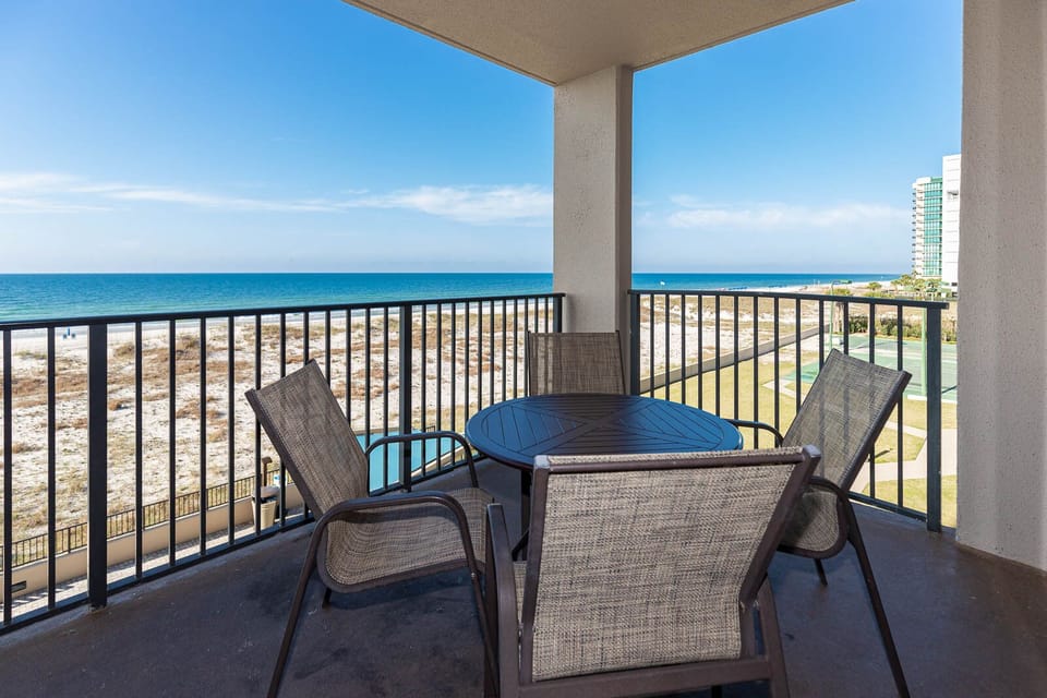 Savor your morning coffee at the outdoor table with a refreshing view of the water and surrounding landscape
