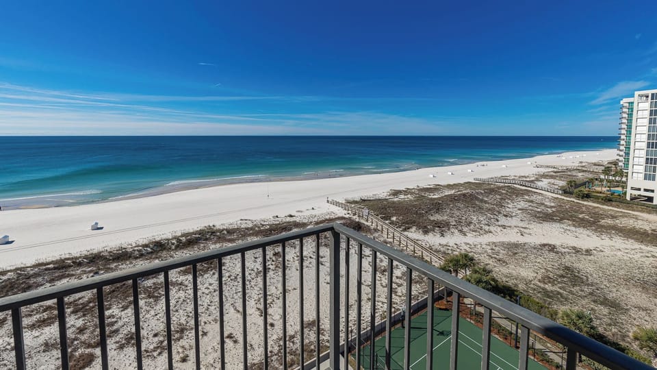 Breathe in the salty air while gazing at the endless beach and deep blue horizon from your balcony