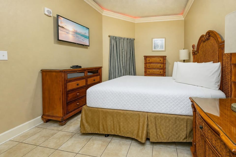 Your queen guest suite surrounds you with gentle textures and a TV ready for your favorite shows