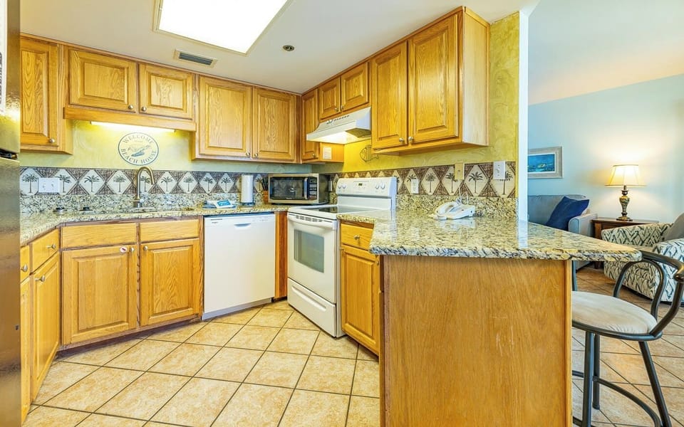 Warm under-cabinet lighting guides your hands as you prepare meals and feel at home in this kitchen