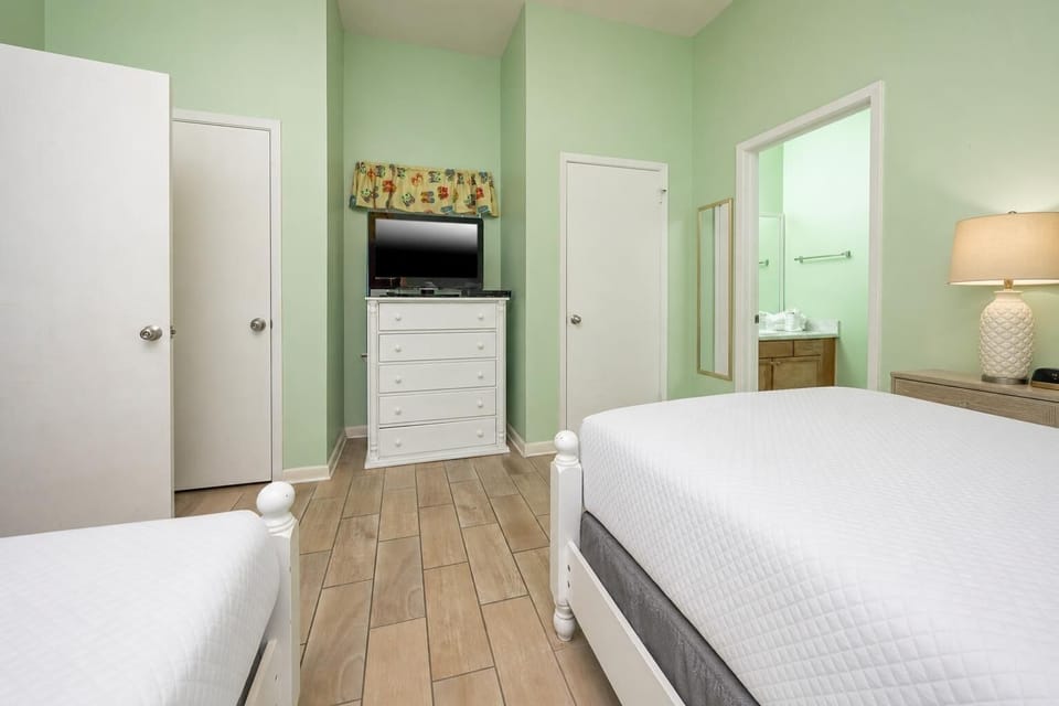 Unwind in this guest room with two beds, a TV, and a vibrant coastal decor for a relaxing stay