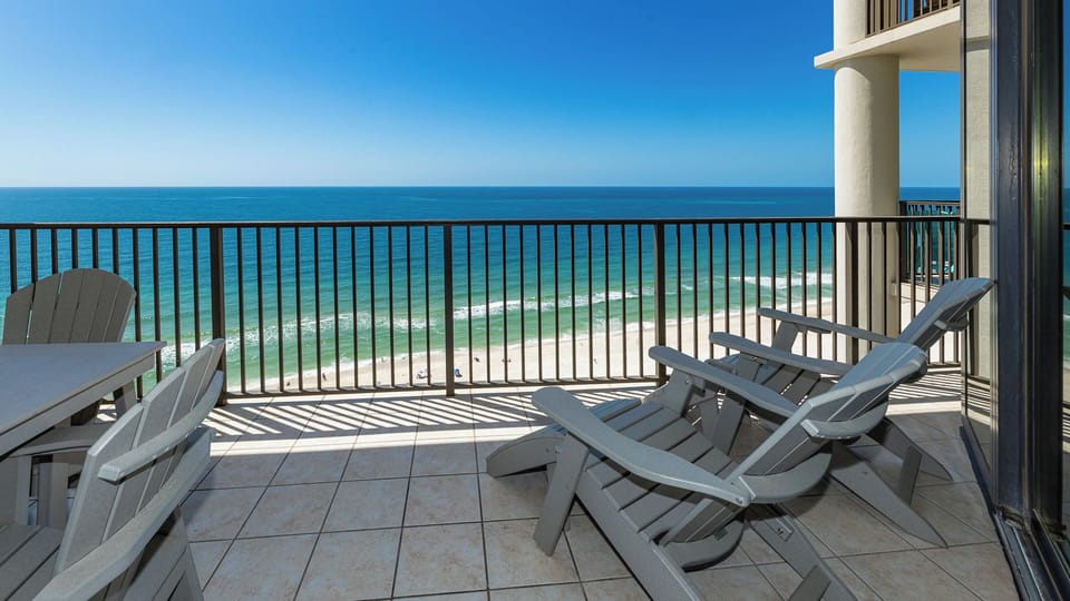 Lounge on your beach front balcony overlooking the shoreline and sparkling waves