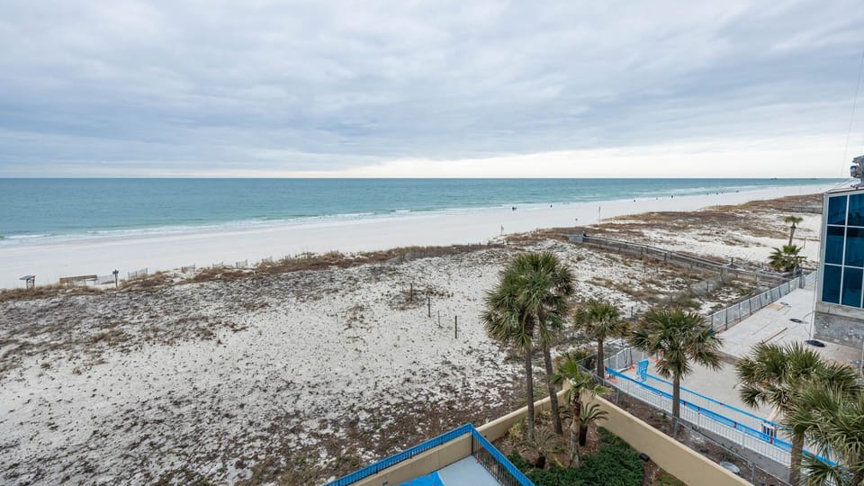 Breathe in the fresh air while enjoying views of the tranquil shoreline and gentle waves from your balcony
