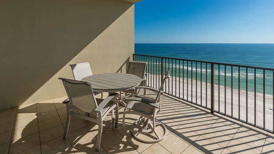 Relax on your balcony, taking in the vibrant coastal views as you cherish moments of serenity and connection