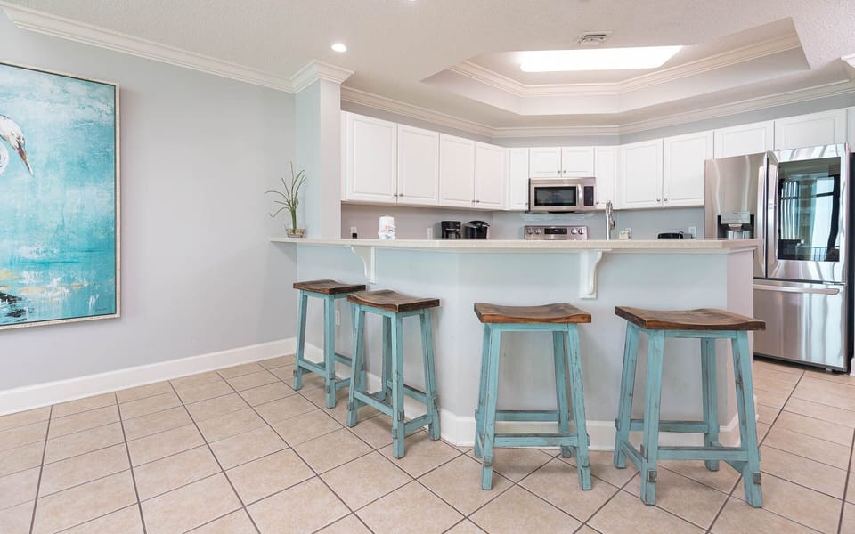 Enjoy a casual breakfast at the charming bar stools, connecting with family over fresh coffee and morning treats
