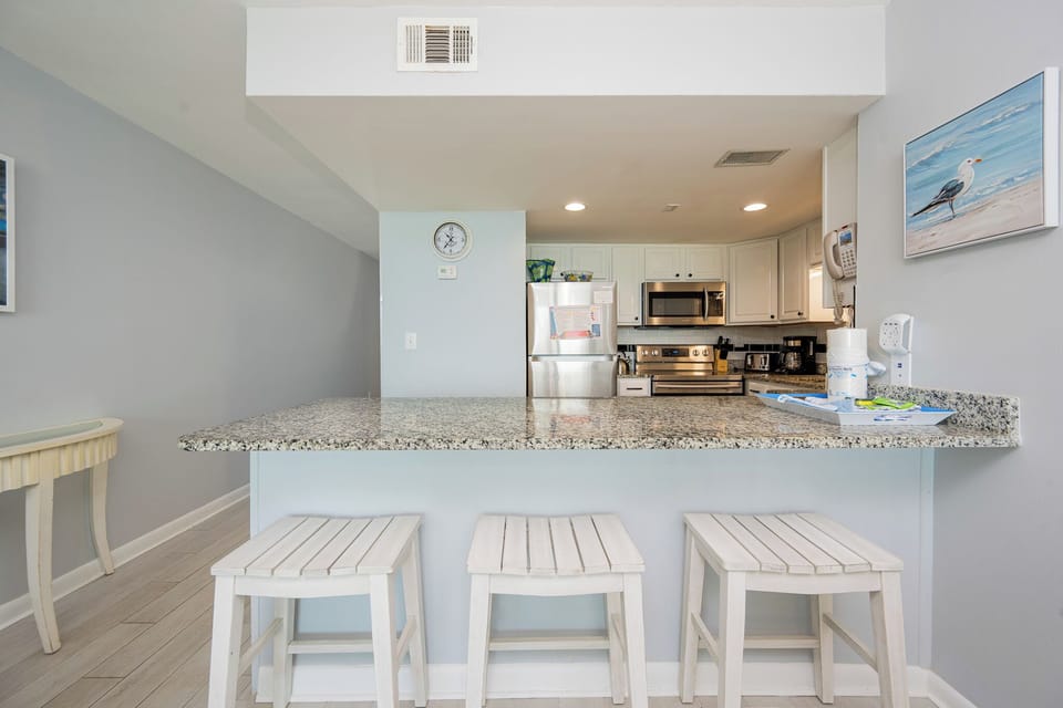 Gather your family around the breakfast bar to enjoy casual conversations and fun moments in this inviting kitchen