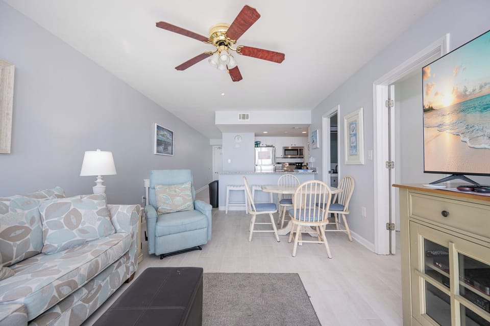 Relax in the inviting living space, where cozy seating and vibrant decor create the perfect setting for family gatherings