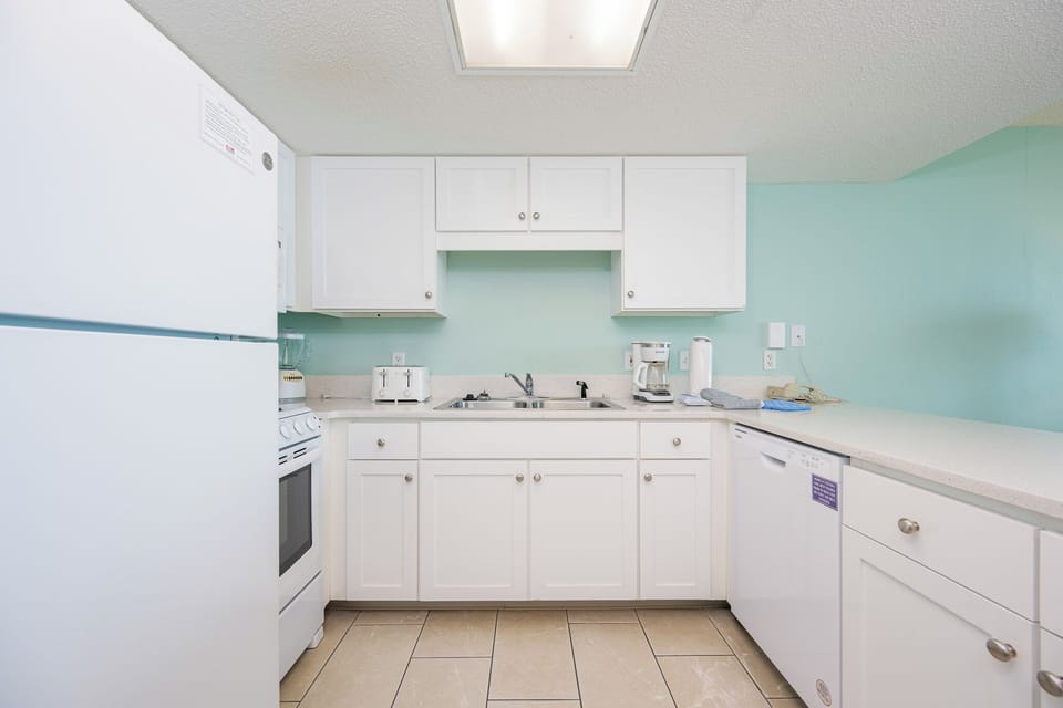 Discover a hotel kitchen that transforms your beach retreat into ultimate convenience, just like home