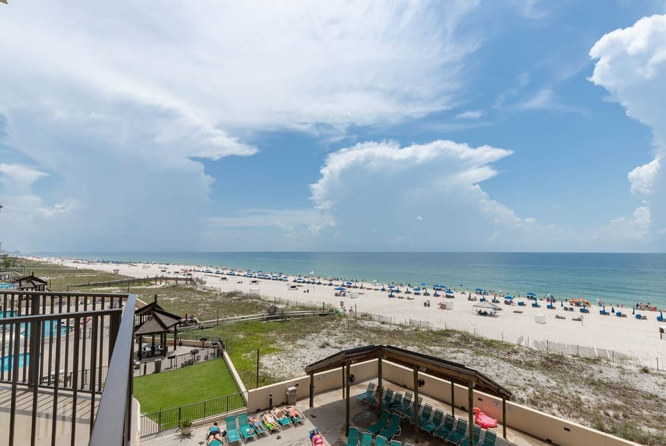 Enjoy breathtaking views of the beach from this extended spacious balcony, perfect for relaxation and soaking up the sun