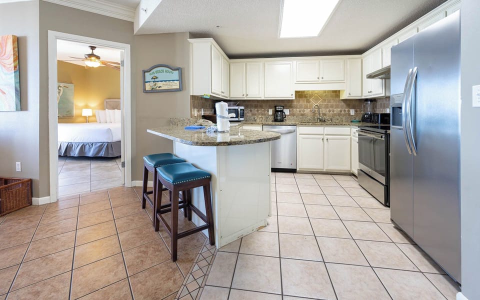 Enjoy cooking in the spacious kitchen featuring granite countertops, stainless appliances, and a convenient breakfast bar