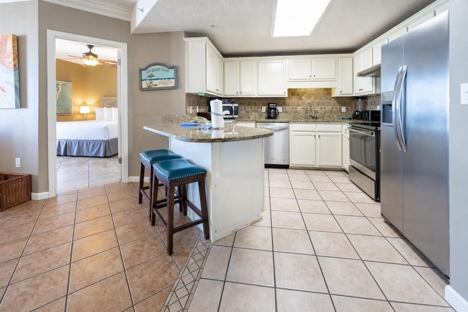 Enjoy cooking in the spacious kitchen featuring granite countertops, stainless appliances, and a convenient breakfast bar