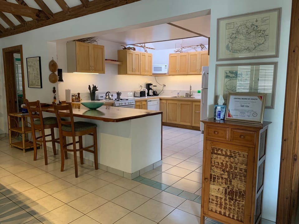 The well equipped kitchen and the breakfast bar open off the main room 