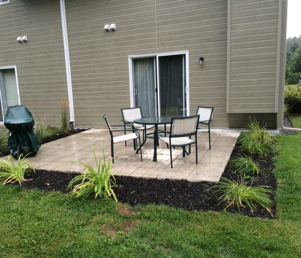 Landscaped terrace with dining and barbeque