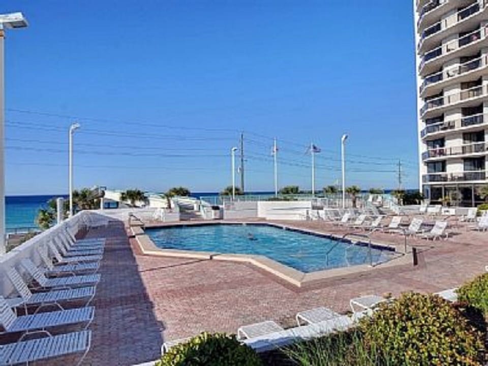 Large heated swimming pool lounge around the pool