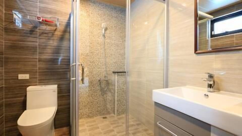 Shower, free toiletries, hair dryer, slippers